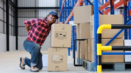 man with a stack of boxes